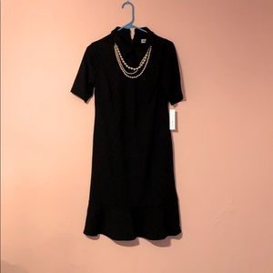 Classy black dress with gold chain necklace